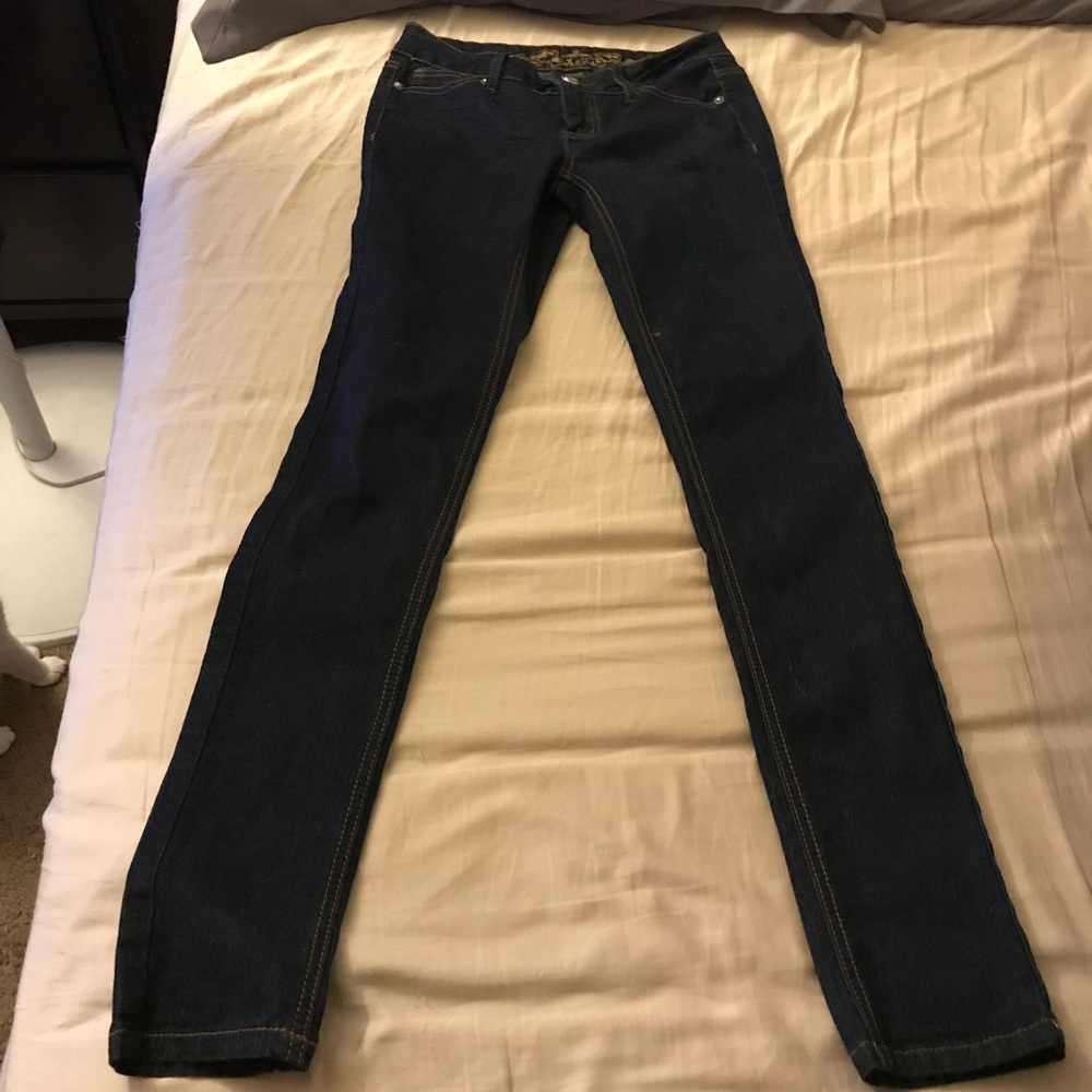 Long dark blue skinny jeans